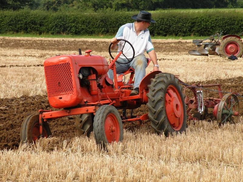 daniel-mycock-on-his-1950-allis-chalmers-b-pulling-an-oliver-2-furrow-trailing-plough