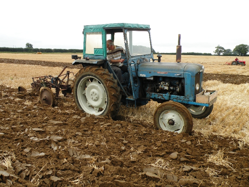 david-askew-on-his-1964-super-major-pulling-a-ransome-2-furrow-trailed-plough