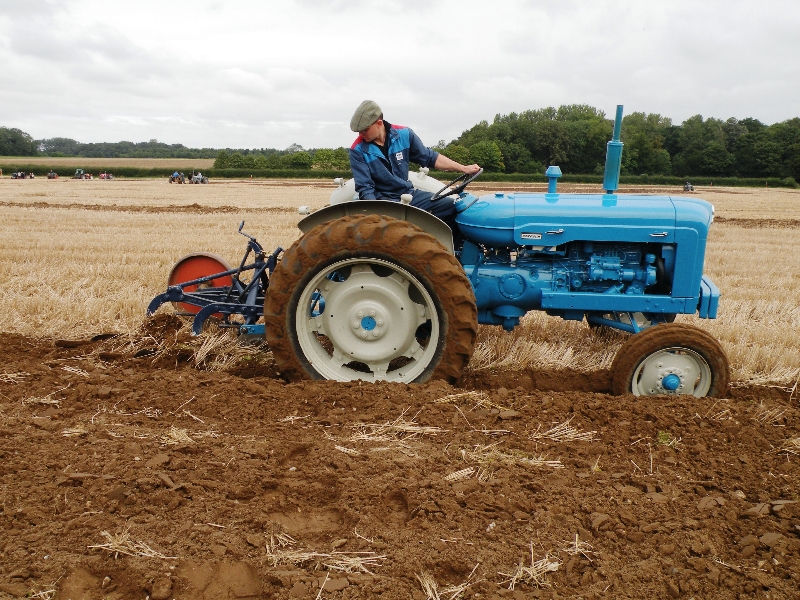 jim-brown-on-his-1964-new-performance-super-major-with-a-2-furrow-ransome-plough