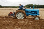 jim-brown-on-his-1964-new-performance-super-major-with-a-2-furrow-ransome-plough